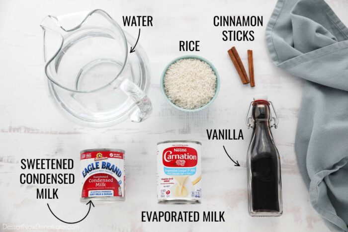 Ingredients for horchata: water, rice, cinnamon sticks, sweetened condensed milk, evaporated milk, and vanilla.