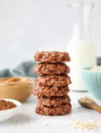 Easy no bake cookies made with peanut butter and chocolate stacked high.