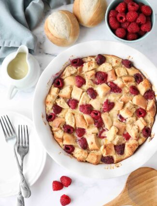 Top view of baked raspberry bread pudding aka baked french toast with raspberries.