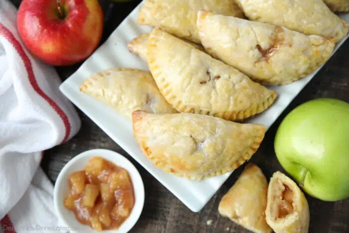 Top view of mini apple hand pies with glaze on top.