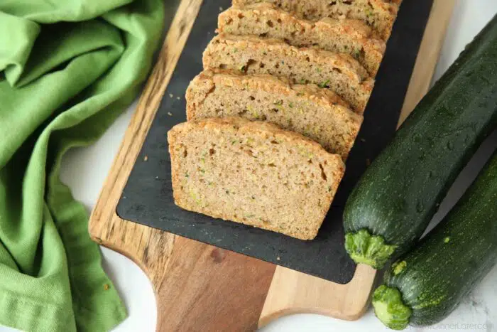 Sliced zucchini bread on a tray.