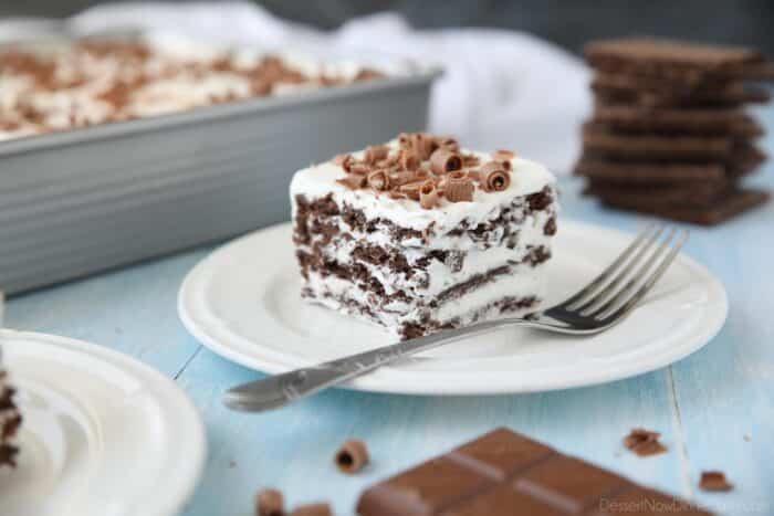 A slice of chocolate icebox cake with chocolate shavings on top.