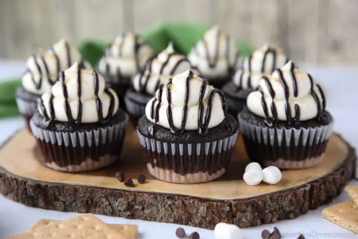 S'mores Cupcakes with layers of graham cracker, chocolate, and marshmallow.