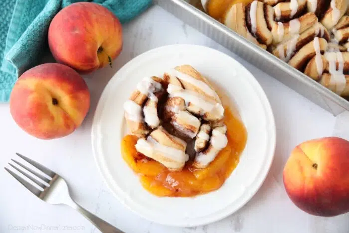 Cinnamon Roll Peach Cobbler on a plate.