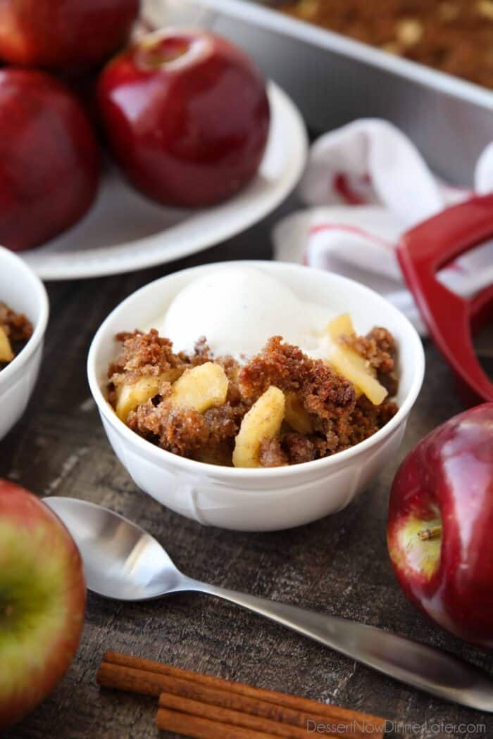 Bowl-full of baked apples topped with sweet buttered bread crumbs.