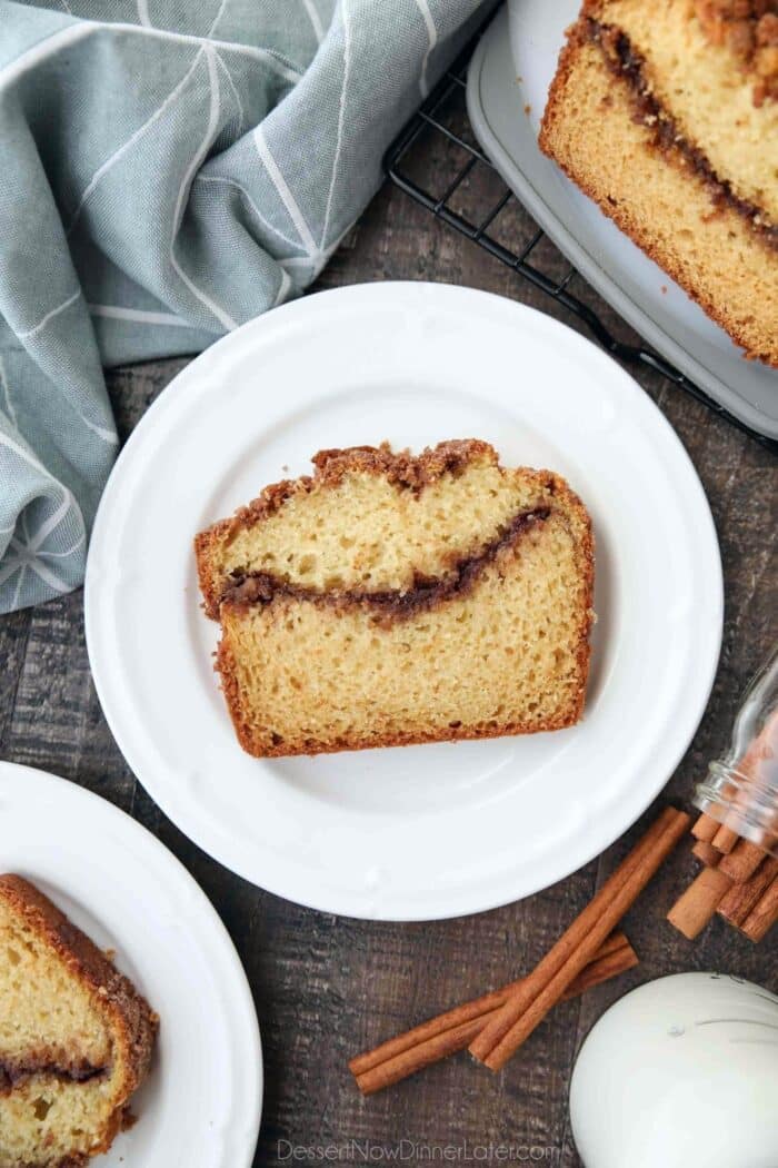 Slice of loaf cake with a cinnamon swirl center.