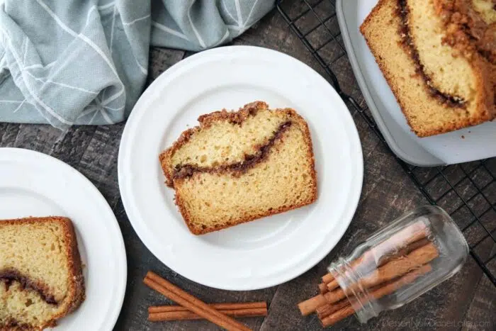 Slice of loaf cake with a ribbon of cinnamon in the middle.