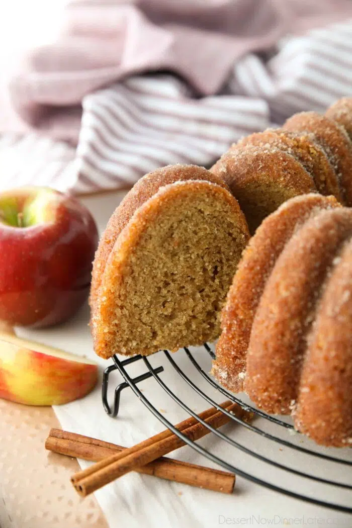 Slice being removed from the apple cider donut cake.