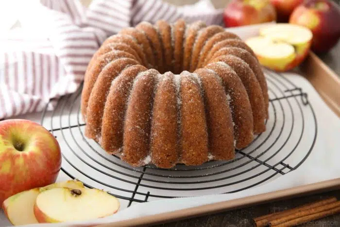 Apple Cider Donut Cake on a cooling rack.