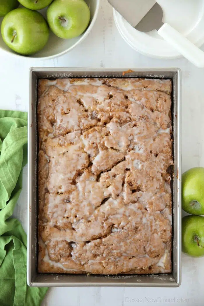 Glazed apple fritter cake in a 9x13-inch pan.