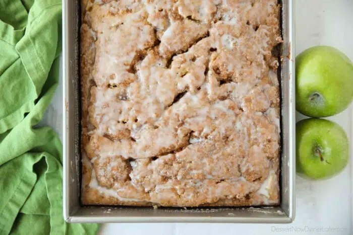 Top view of glazed apple cinnamon cake in a 13x9-inch pan.