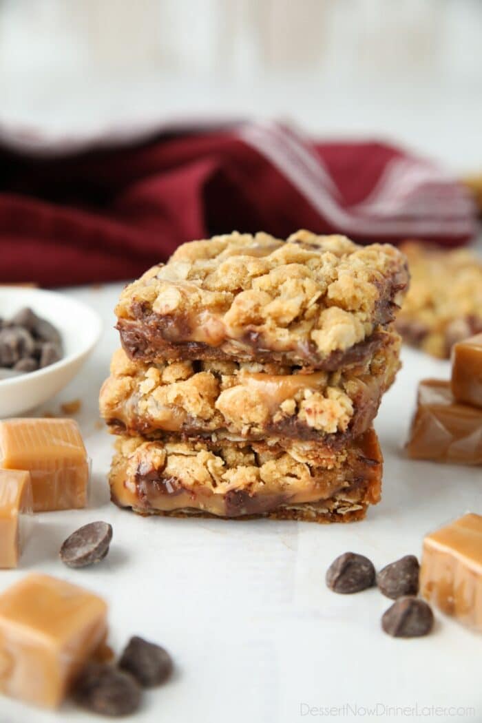 A stack of Caramelitas surrounded by chocolate chips and caramel squares.