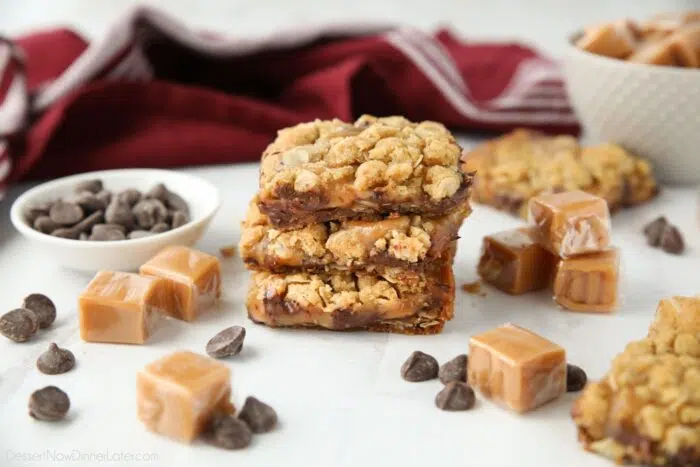 A stack of Caramelitas surrounded by chocolate chips and caramel squares.