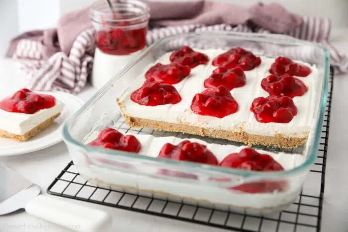 Cherry Delight recipe made in a 9x13 pan with some slices removed.