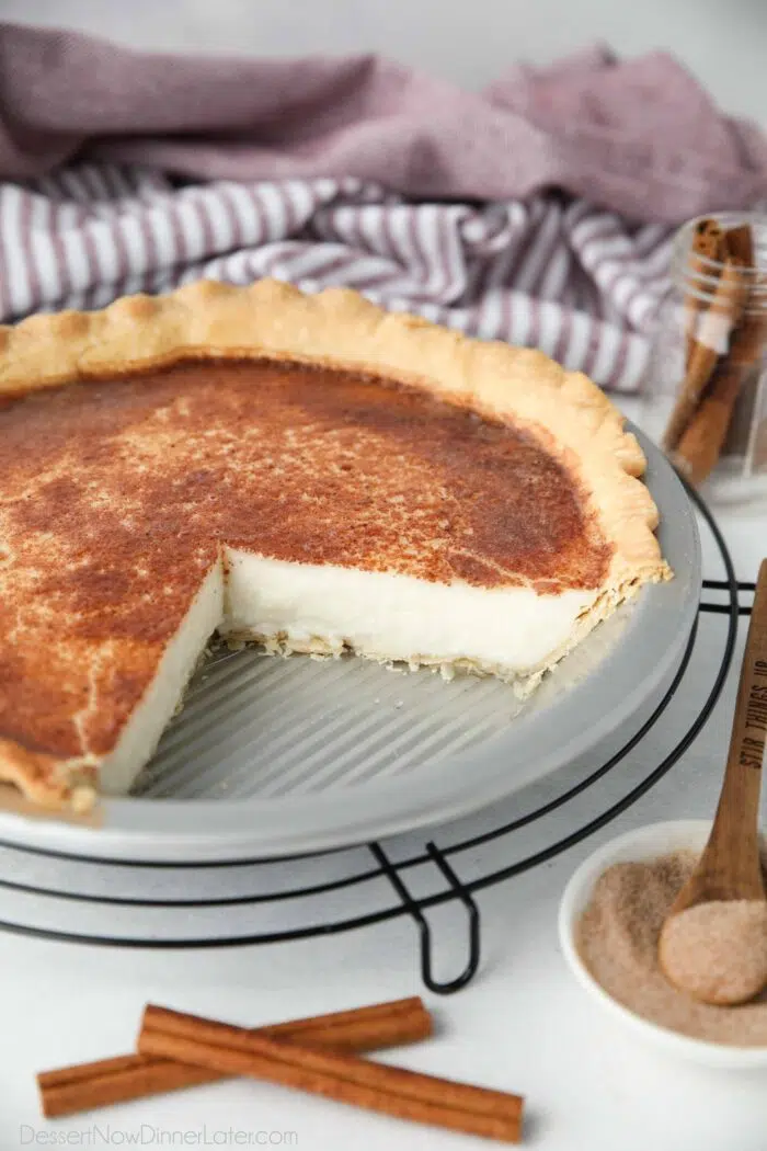 Sugar Cream Pie in a tin with a couple of slices removed.