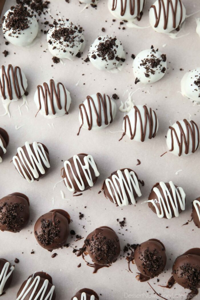 Drizzled chocolate and crushed cookies on top of dipped Oreo Balls.