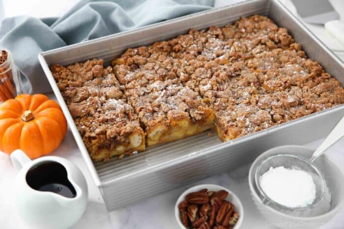 Pumpkin French Toast Casserole in a pan with a couple of pieces removed.