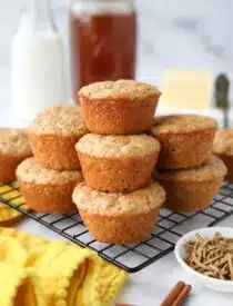 All Bran Muffins stacked on a wire cooling rack.