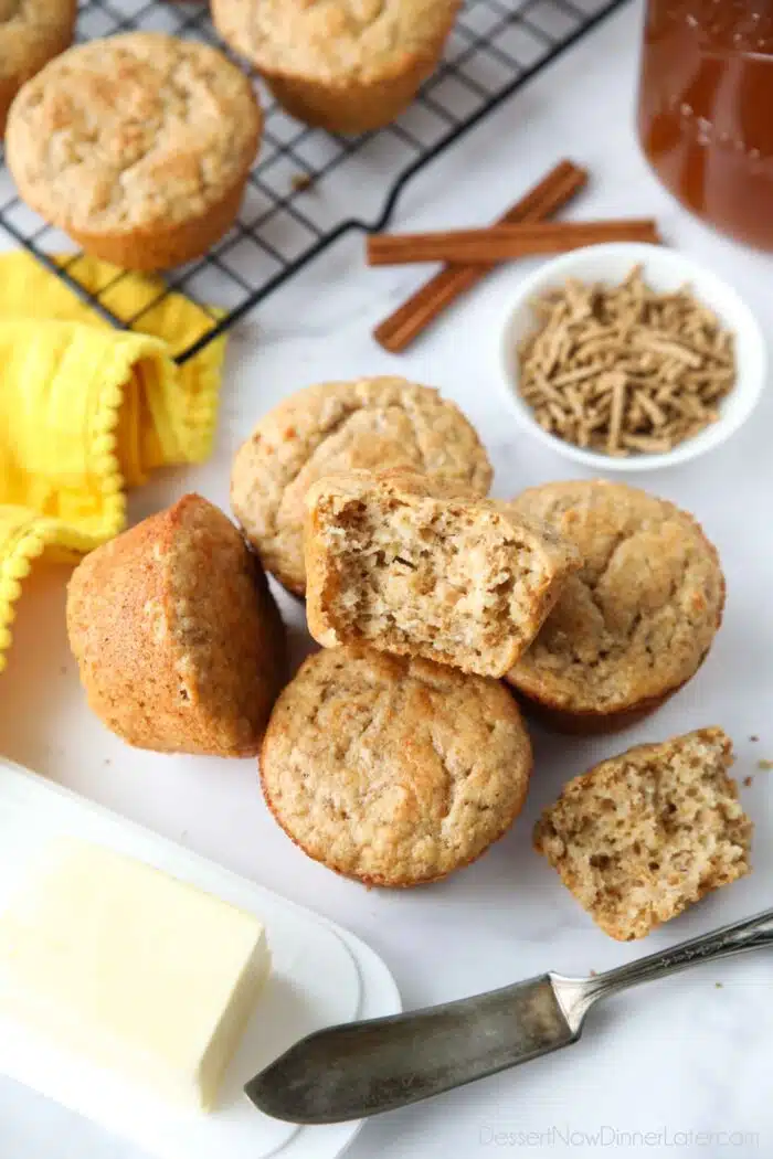 Muffins made with All-Bran cereal, with one muffin showing the light and fluffy interior texture.