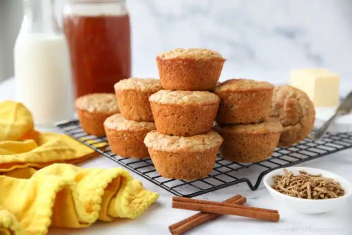 All Bran Muffins stacked on a wire cooling rack.