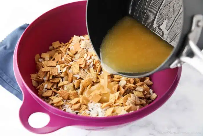 Butter and sugar mixture being poured over cereal.