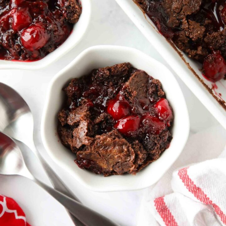 Warm chocolate cherry dump cake in a small bowl.