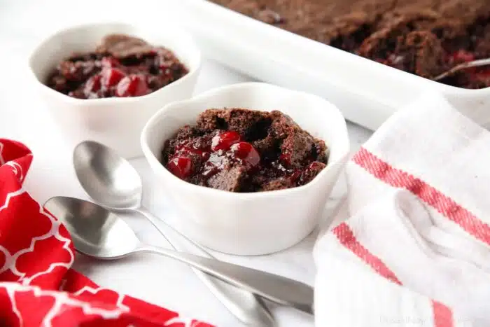 Warm chocolate cherry cobbler in a small bowl.