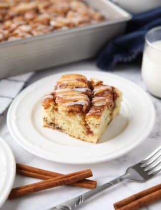 A fluffy vanilla cake filled with cinnamon swirls just like a cinnamon roll.