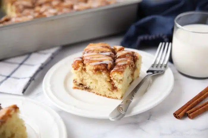 A fluffy vanilla cake filled with cinnamon swirls just like a cinnamon roll.