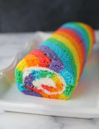 Rainbow Cake Roll on a platter.