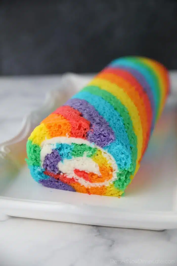 Rainbow Cake Roll on a platter.