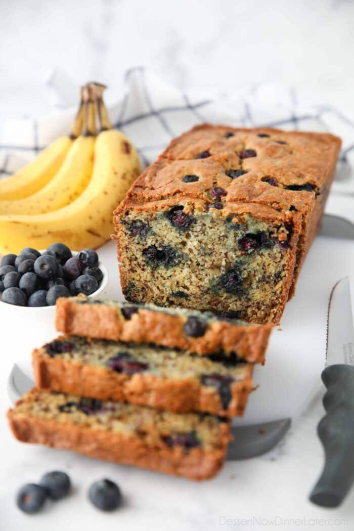 Loaf of banana blueberry bread cut open to show the inside.