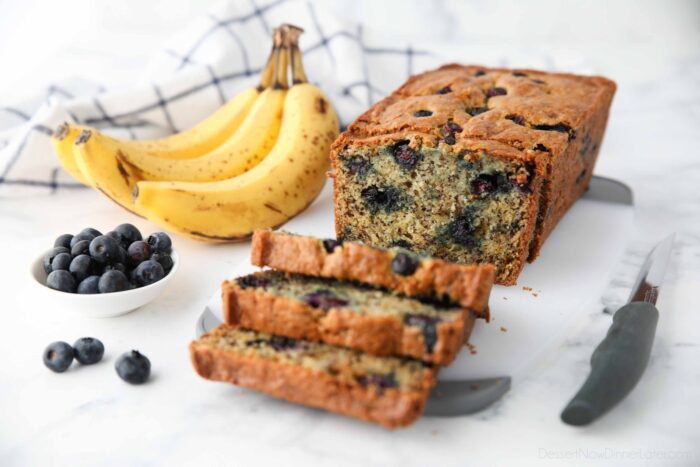 Loaf of banana blueberry bread cut open to show the inside.