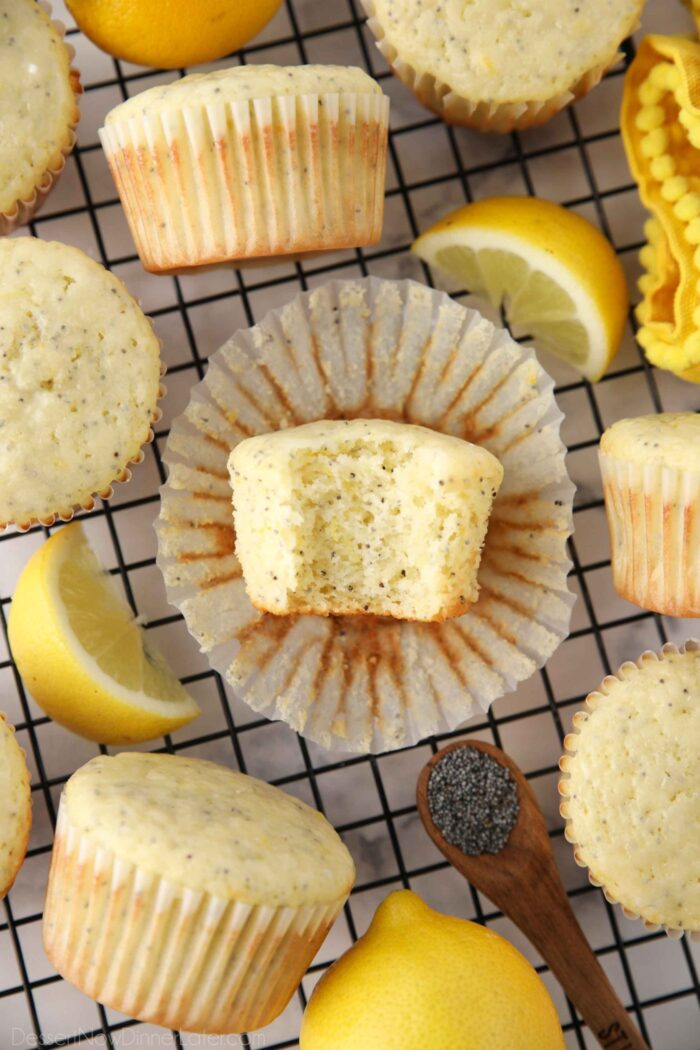 Bite taken out of a lemon poppy seed muffin.