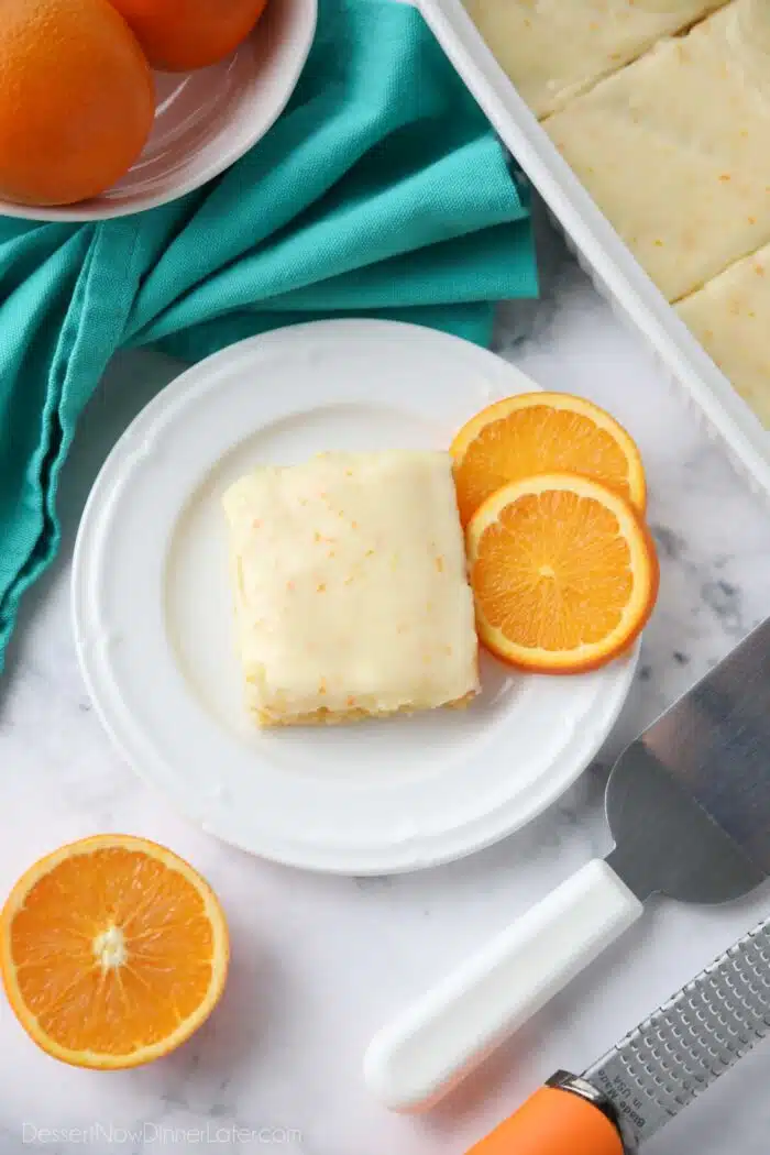 Orange blondies with frosting.