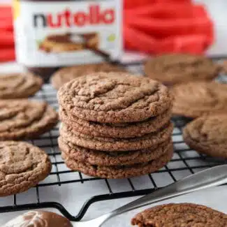 Stack of chocolate nutella cookies on a wire cooling rack.