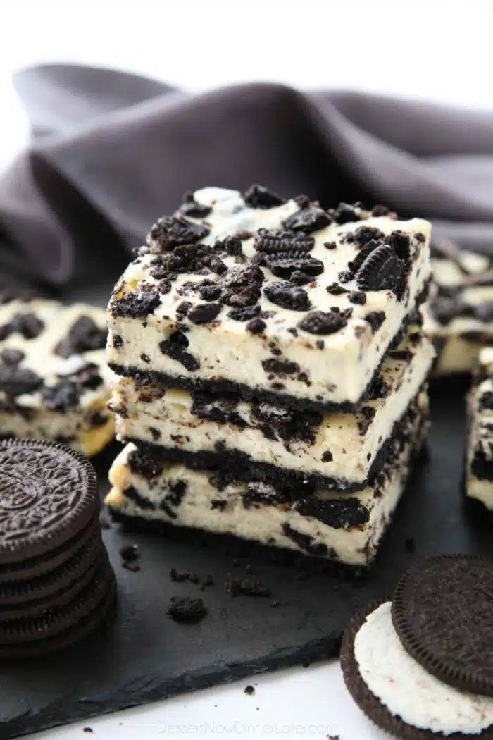 Three Oreo cheesecake bars stacked together.