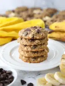 Stack of banana oatmeal chocolate chip cookies on a plate.