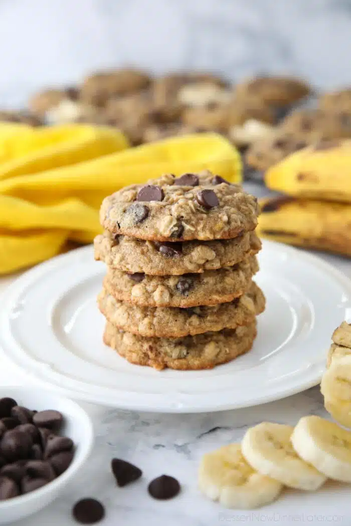 Stack of banana oatmeal chocolate chip cookies on a plate.
