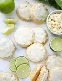 Key Lime Cookies with white chocolate chips topped with a lime glaze.