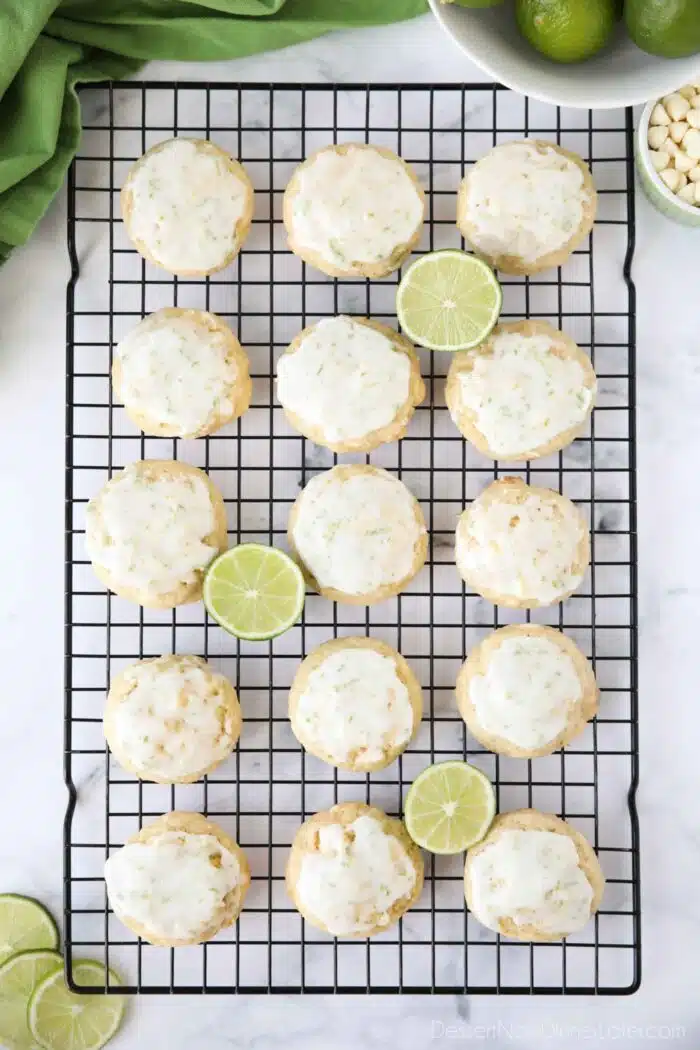 Top view of key lime cookies with glaze on wire cooling rack.