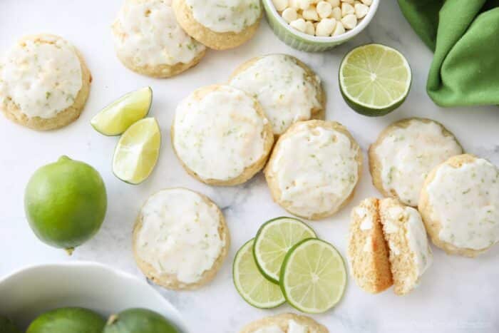 Key Lime Cookies with white chocolate chips topped with a lime glaze.