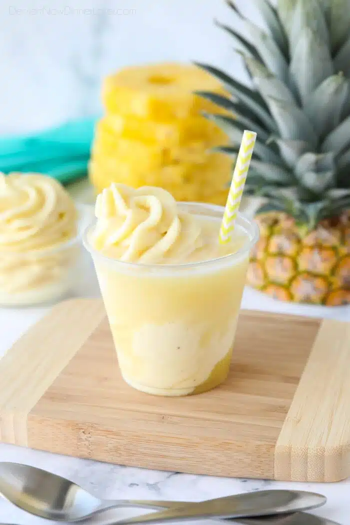 Pineapple Float - Swirled pineapple ice cream and pineapple juice in a cup with a straw.