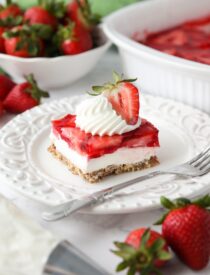 Strawberry Pretzel Salad - A layered dessert with a pretzel crust, cream cheese filling, and topped with fresh strawberries inside jello.