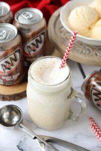 Mason jar mug full of root beer freeze and a straw.