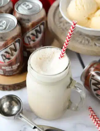 Mason jar mug full of root beer freeze and a straw.