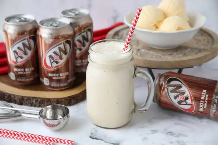 Mason jar mug full of root beer freeze and a straw.