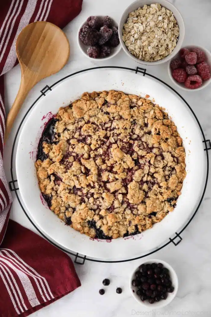 Dish of baked berry crisp; also known as berry crumble.