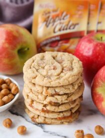 Stack of caramel apple cider cookies made with apple cider mix and caramel bits.