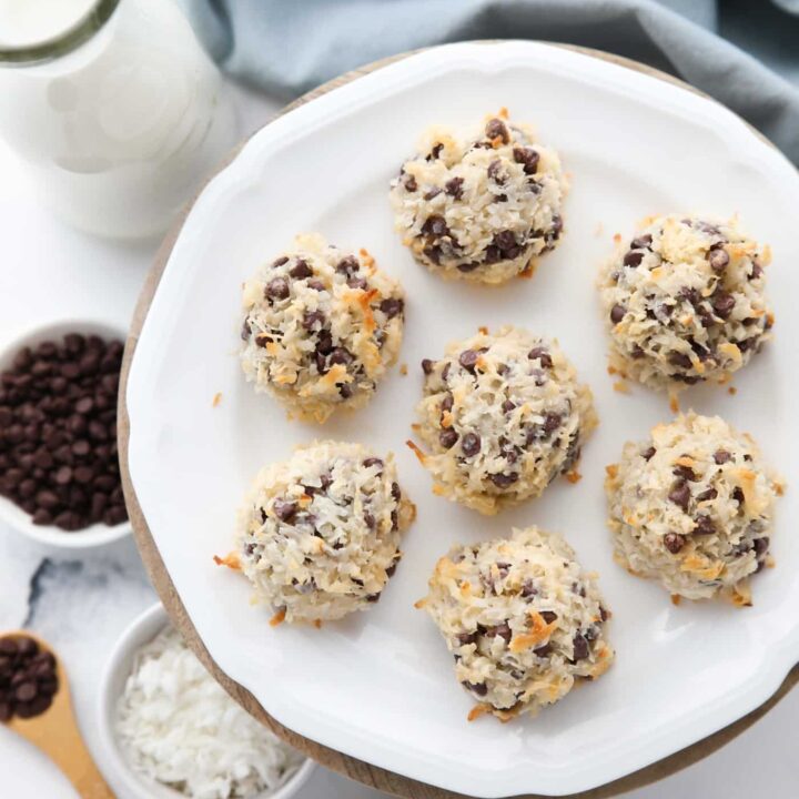 Plate of coconut macaroons with condensed milk and mini chocolate chips.